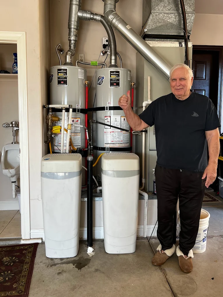 Happy homeowner after water heater installation by Free Flow Plumbing in St. George Utah